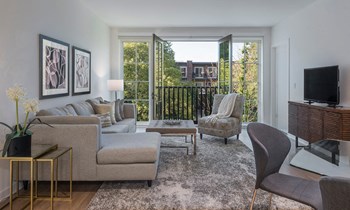 Living area and balcony view - Kelmscott Park Apartments